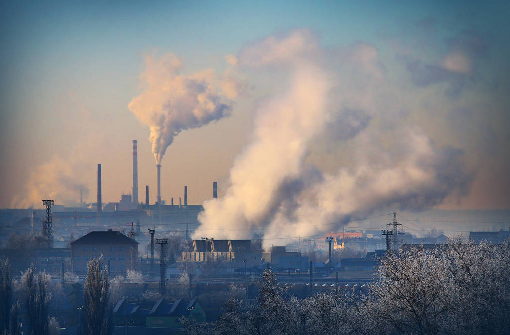 A smoking stack emits from a lignite combined heat and power plant.