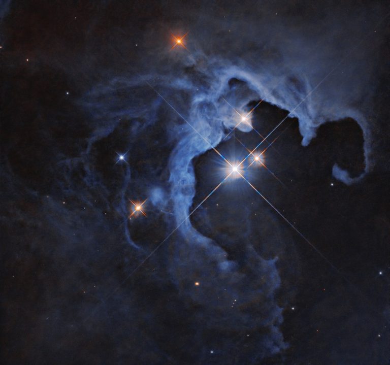 This NASA Hubble Space Telescope image captures a triple-star system.