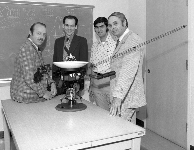 Ed Stone, second from left, and other members of the Voyager team pose with a model of the spacecraft in 1977, the year the twin probes launched. Credit: NASA/JPL-Caltech